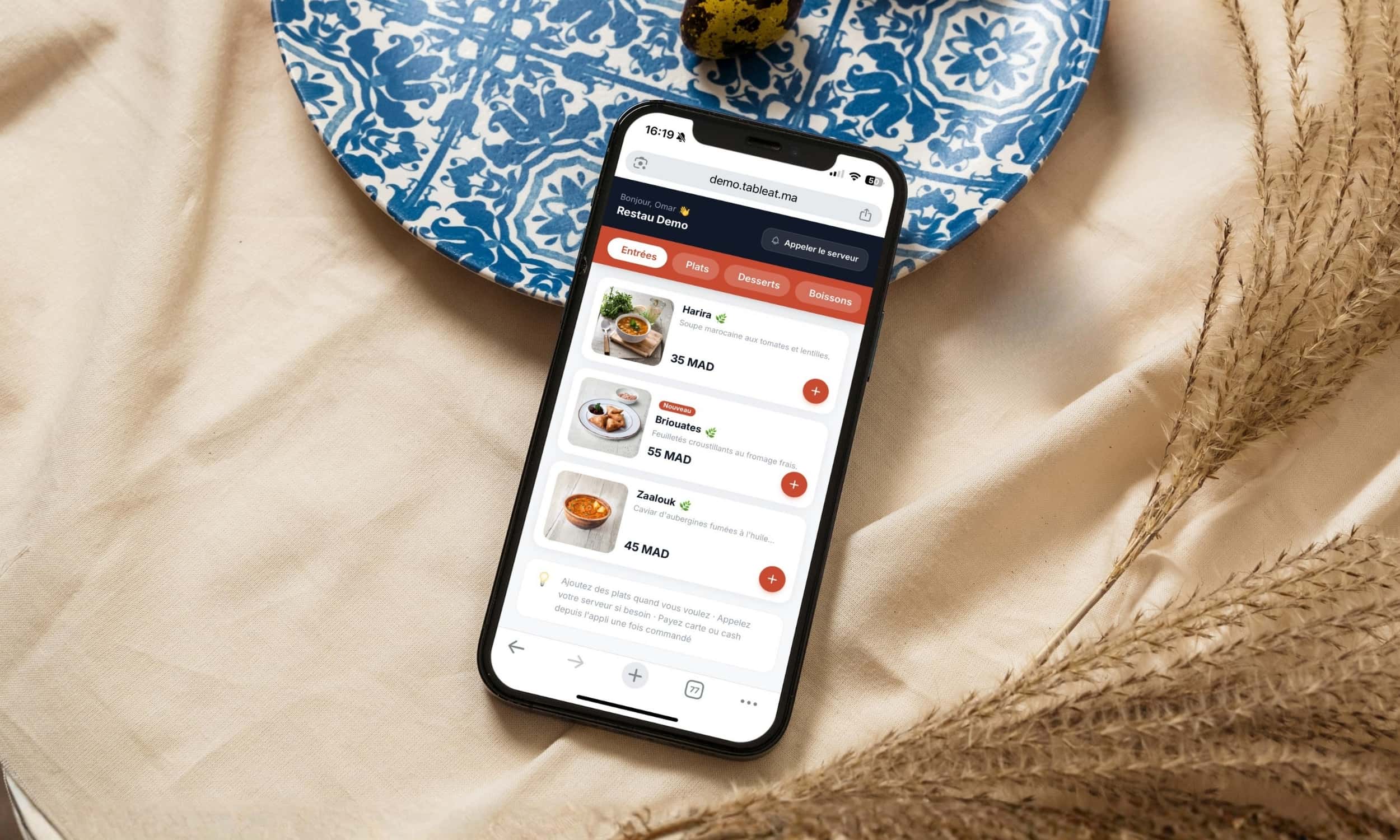 Écran de téléphone affichant le menu Tableat